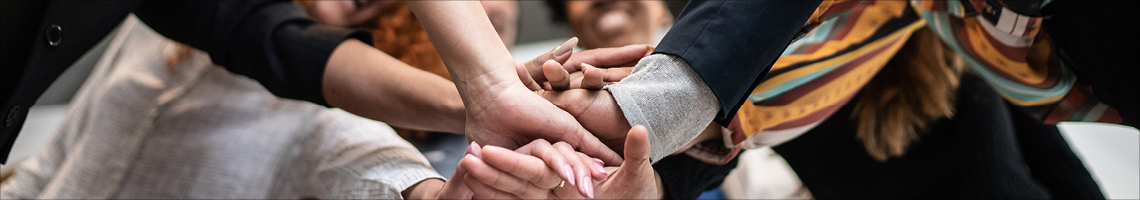 image of group of peoples hands.